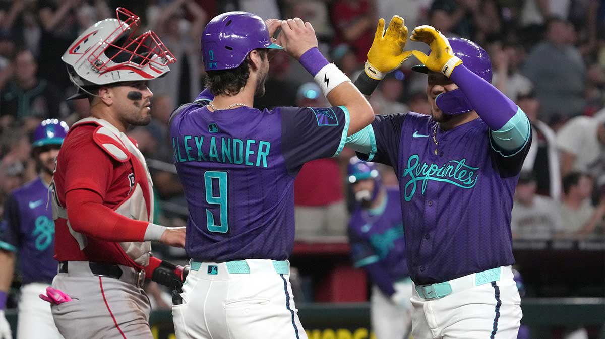 Arizona Diamondbacks second base Ildemaro Vargas (6) celebrates with shortstop Blaze Alexander (9) after hitting a three run home run against the Boston Red Sox in the third inning at Chase Field.