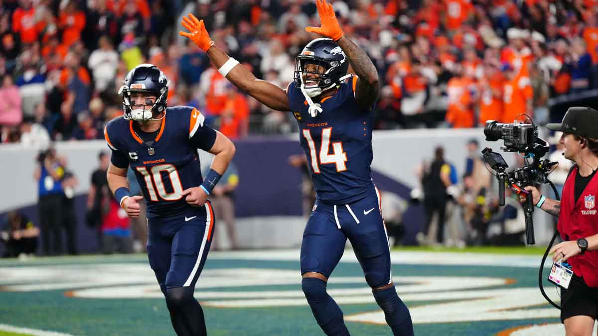 Denver Broncos wide receiver Courtland Sutton (14) celebrates after scoring a touchdown on a pass from Denver Broncos quarterback Bo Nix (10) during the second quarter against the Cincinnati Bengals at Empower Field at Mile High.