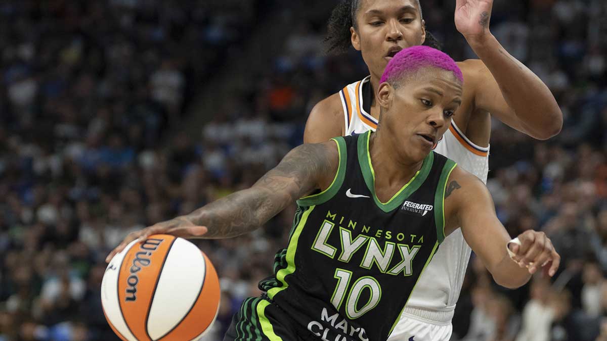 Minnesota Lynx guard Courtney Williams (10) dribbles the ball past Phoenix Mercury forward Alyssa Thomas (25) in the first half during game one of the second round for the 2025 WNBA Playoffs at Target Center.