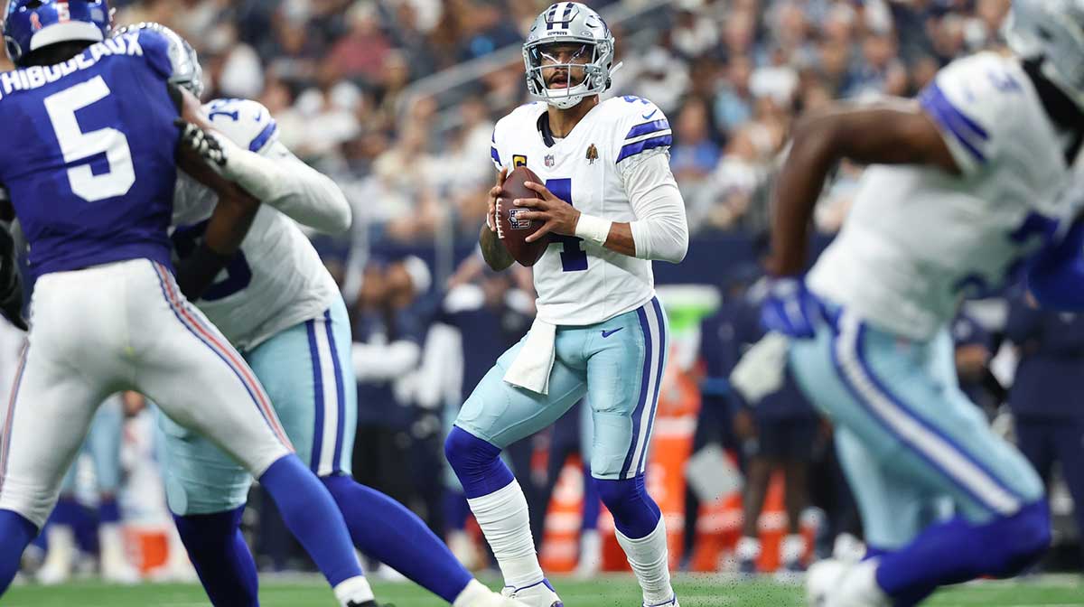Dallas Cowboys quarterback Dak Prescott (4) looks to pass the ball against the New York Giants during the second quarter at AT&T Stadium.