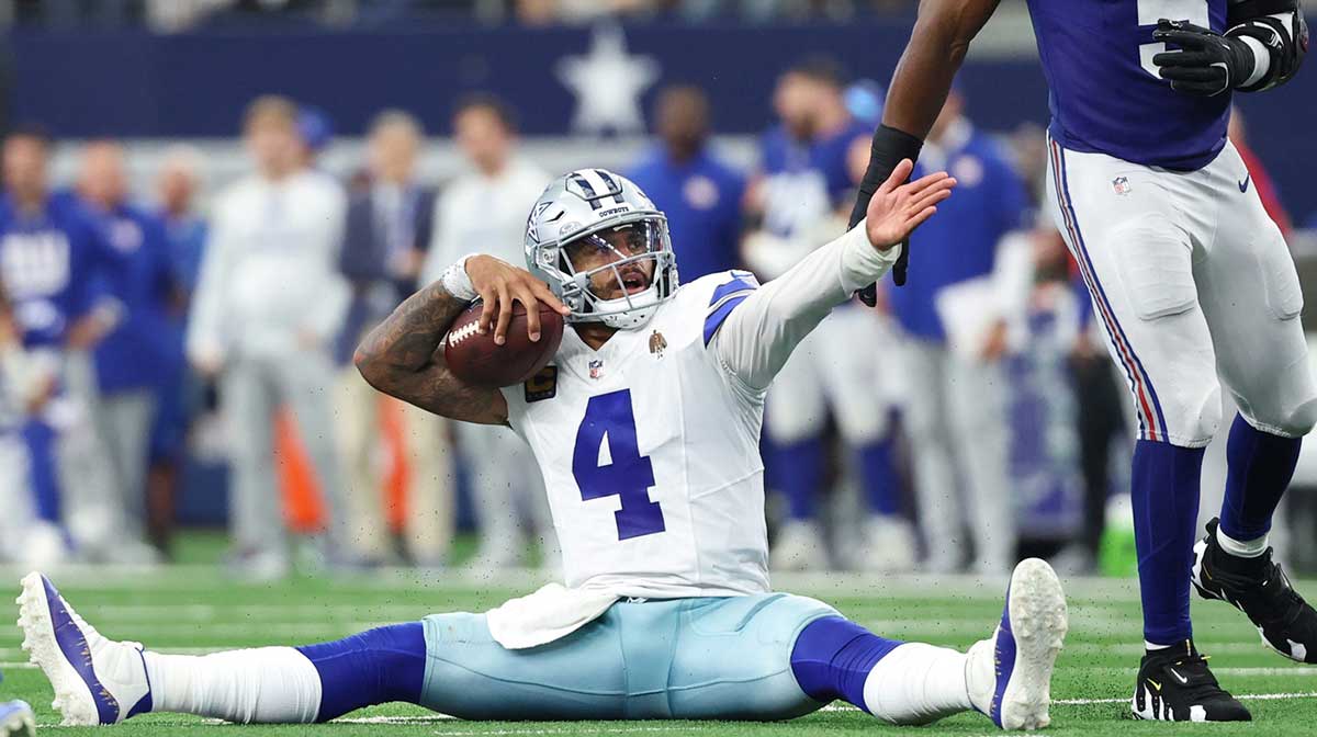 Dallas Cowboys quarterback Dak Prescott (4) reacts after a play against the New York Giants during overtime at AT&T Stadium.