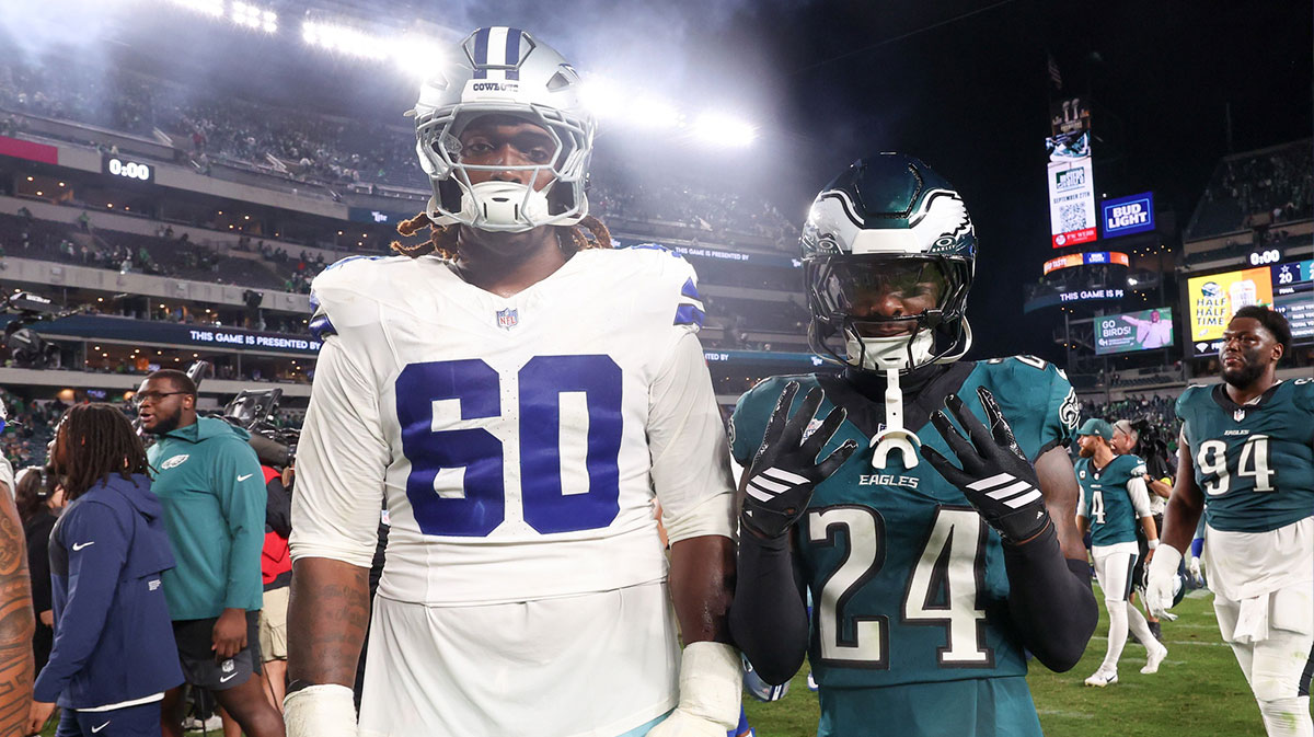 Dallas Cowboys offensive tackle Tyler Guyton (60) and Philadelphia Eagles safety Andrew Mukuba (24) pose for a photo after the game at Lincoln Financial Field.