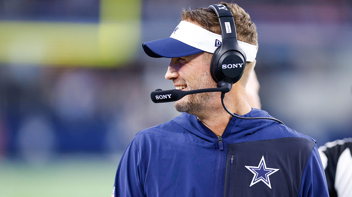 Cowboys head coach Brian Schottenheimer smiles during the first quarter against the Atlanta Falcons at AT&T Stadium