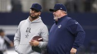 Cowboys quarterback Dak Prescott (4) talks to head coach Mike McCarthy before the game against the Washington Commanders at AT&T Stadium