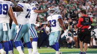 Cowboys running back Javonte Williams (33) celebrates with his teammates after scoring a touchdown against the Philadelphia Eagles during the first quarter of the game at Lincoln Financial Field