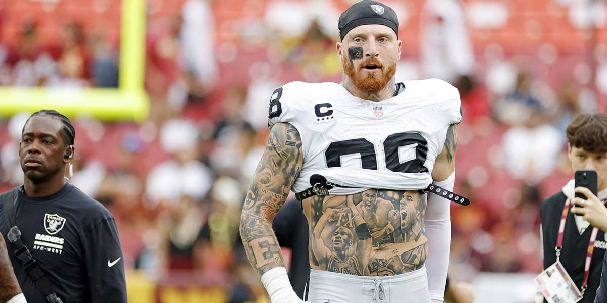 Las Vegas Raiders defensive end Maxx Crosby (98) warms up before the game against the Washington Commanders at Northwest Stadium.