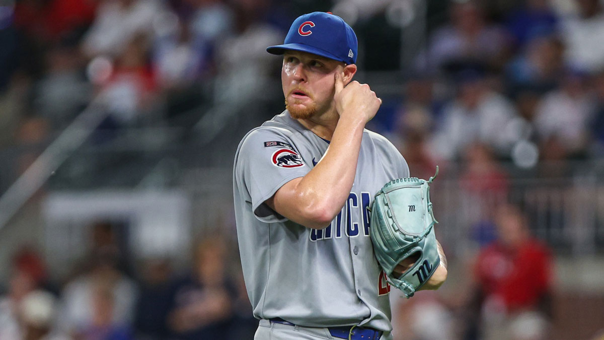Cubs pitcher Cade Horton (22) walks to the dugout after pitching against the Atlanta Braves during the seventh inning at Truist Park