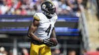 Pittsburgh Steelers wide receiver Dk Metcalf (4) reacts after touchdown during the first quarter at Gillette Stadium.