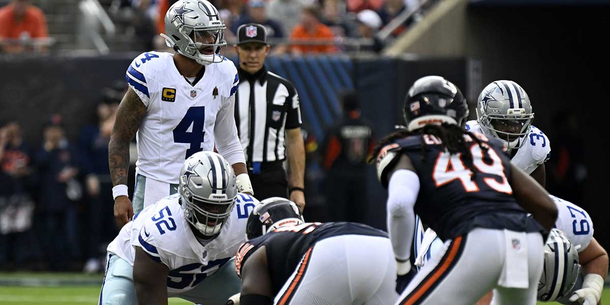 Dallas Cowboys quarterback Dak Prescott (4) calls out an audible against the Chicago Bears during the first half at Soldier Field.
