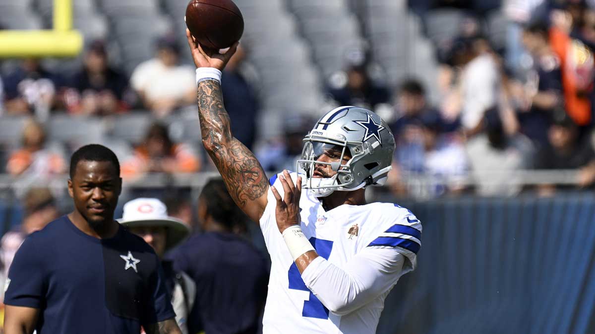 Dallas Cowboys quarterback Dak Prescott (4) practices before the game at Soldier Field.