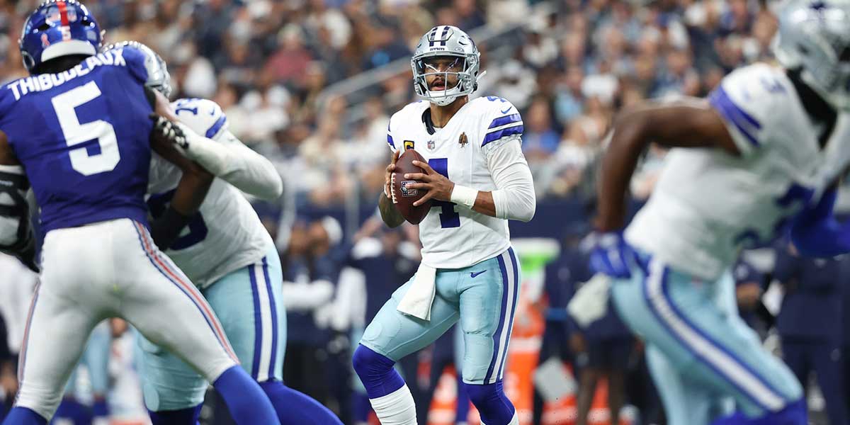 Dallas Cowboys quarterback Dak Prescott (4) looks to pass the ball against the New York Giants during the second quarter at AT&T Stadium.