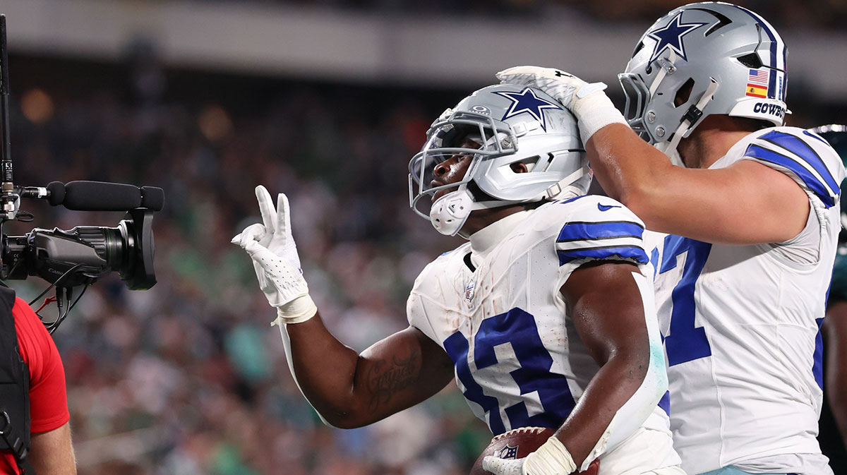 Dallas Cowboys running back Javonte Williams (33) celebrates with his teammates after scoring a touchdown against the Philadelphia Eagles during the first quarter of the game at Lincoln Financial Field.