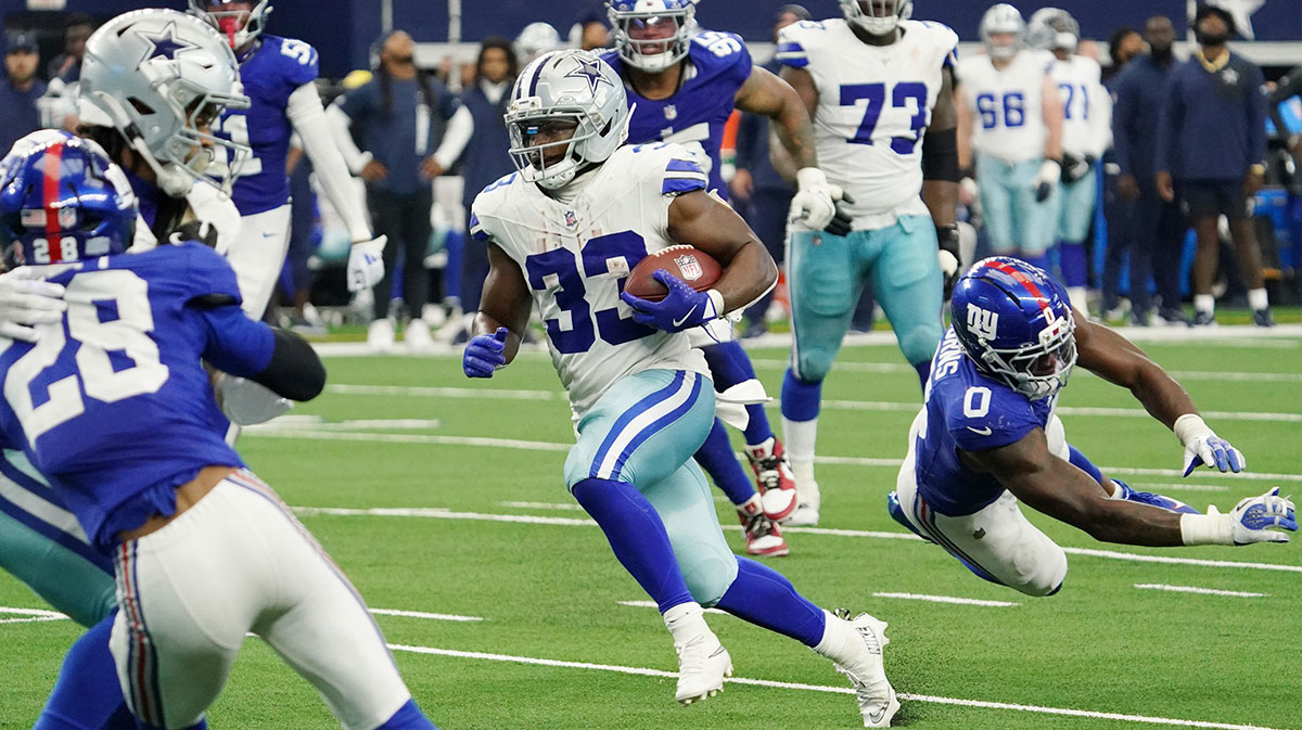 Dallas Cowboys running back Javonte Williams (33) runs with the ball against the New York Giants during the fourth quarter at AT&T Stadium.