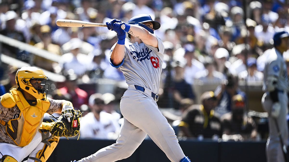 Aug 24, 2025; San Diego, California, USA; Los Angeles Dodgers catcher Dalton Rushing (68) hits a three-run home run during the seventh inning against the San Diego Padres at Petco Park. 