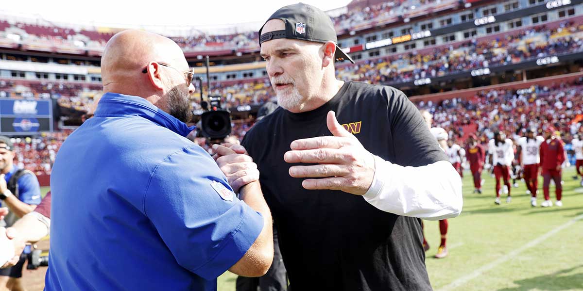 The Washington Commanders head coach Dan Quinn and New York Giants head coach Brian Daboll react after the game at Northwest Stadium.
