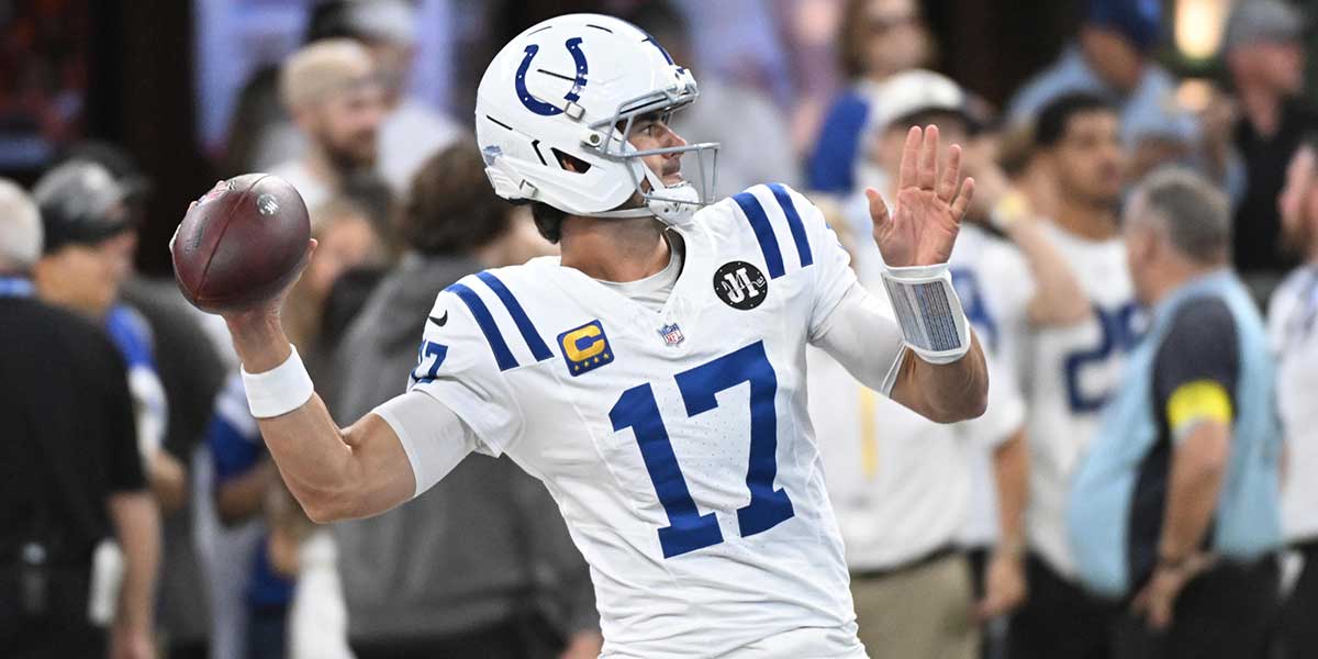 Indianapolis Colts quarterback Daniel Jones (17) warms up prior to the game against the Denver Broncos at Lucas Oil Stadium.