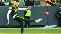 Green Bay Packers punter Daniel Whelan (19) punts the ball in the fourth quarter against the Los Angeles Chargers at Lambeau Field.