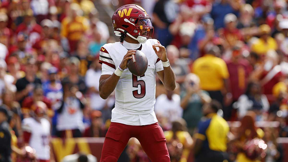 Washington Commanders quarterback Jayden Daniels (5) makes a pass during the fourth quarter against the New York Giants at Northwest Stadium.