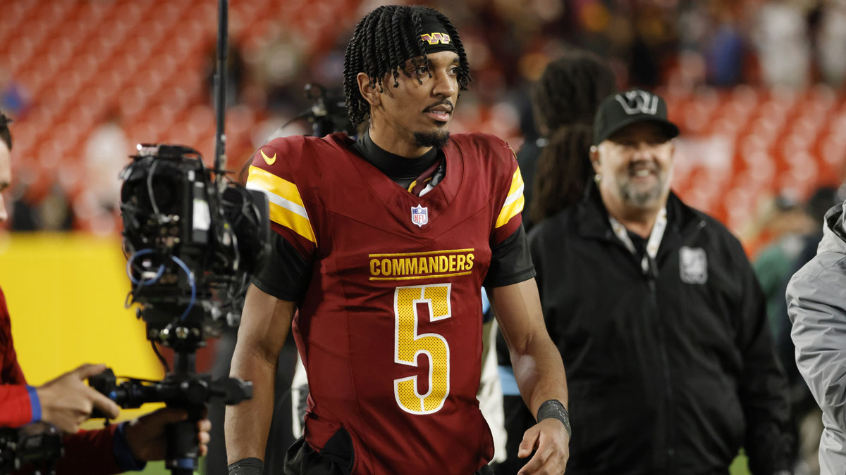 Washington Commanders quarterback Jayden Daniels (5) looks on while leaving the field after defeating the Atlanta Falcons at Northwest Stadium.