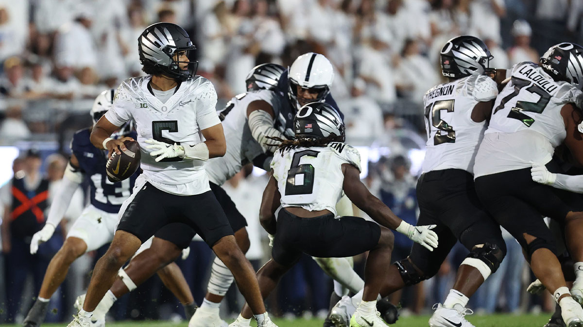 Oregon Ducks quarterback Dante Moore (5) throws during the second quarter against the Penn State Nittany Lions at Beaver Stadium.