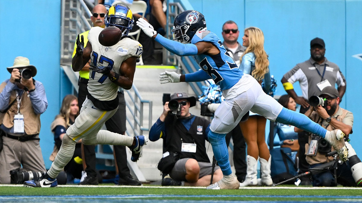 Los Angeles Rams wide receiver Davante Adams (17) scores a touchdown over Tennessee Titans L'Jarius Sneed (38) during the second half at Nissan Stadium.