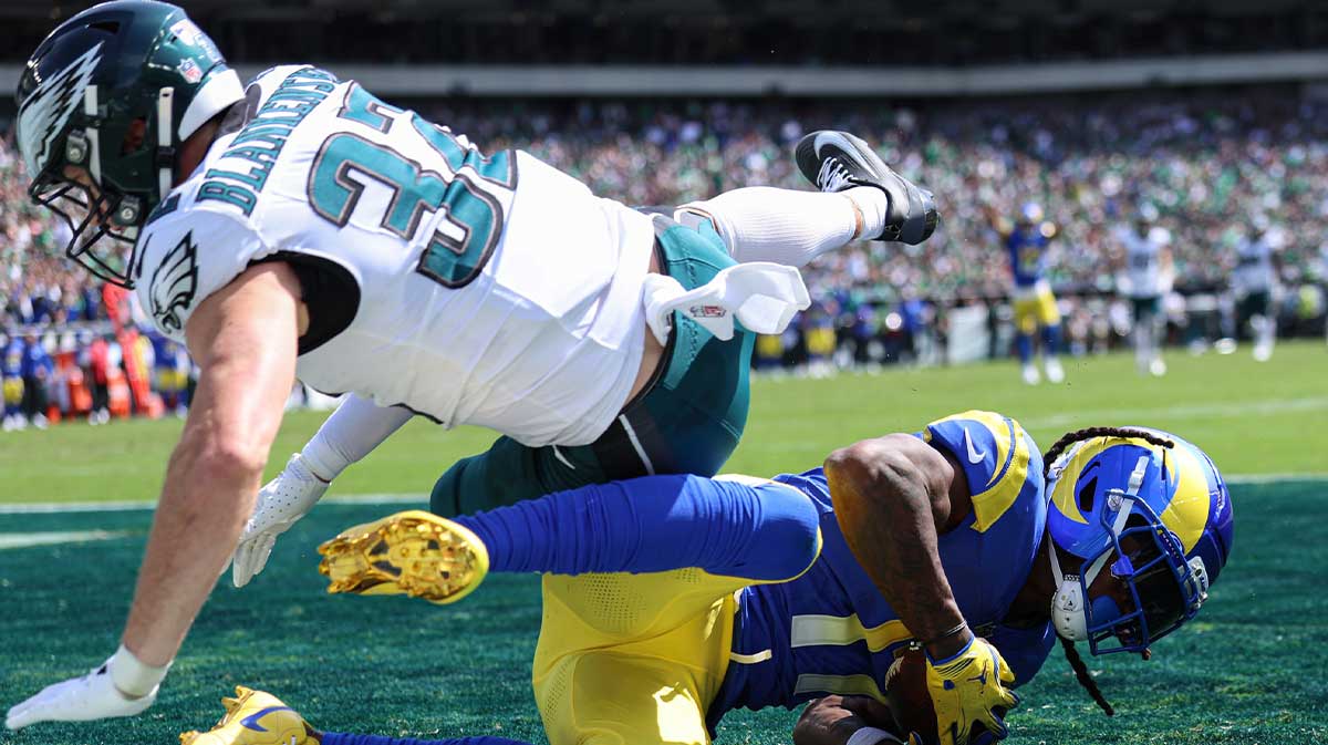 Los Angeles Rams wide receiver Davante Adams (17) makes a touchdown catch over Philadelphia Eagles safety Reed Blankenship (32) during the first half at Lincoln Financial Field.