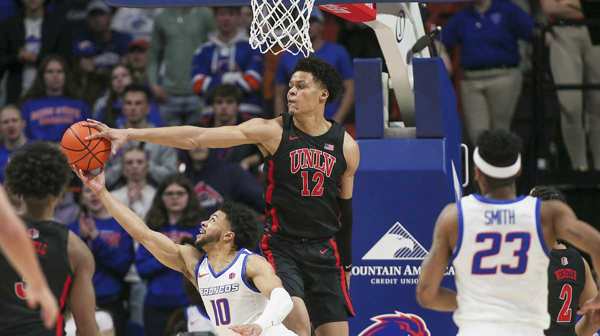 Boise State Broncos guard Marcus Shaver Jr. (10) has shot blocked by UNLV Rebels center David Muoka (12) during the first half at ExtraMile Arena.