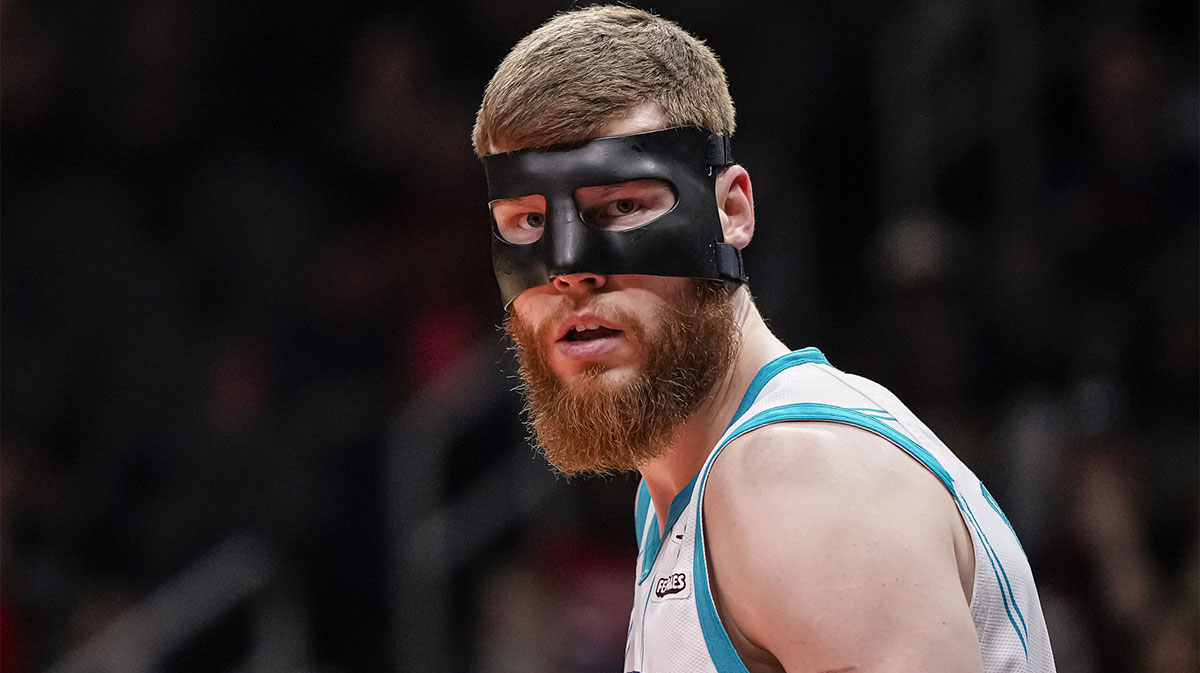 Charlotte Hornets forward Davis Bertans (9) shown on the court wearing a mask against the Atlanta Hawks during the first half at State Farm Arena.