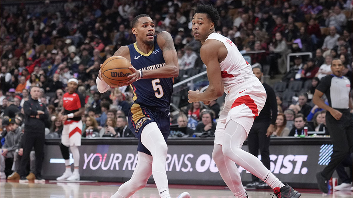 New Orleans Pelicans guard Dejounte Murray (5) controls the ball as Toronto Raptors forward Scottie Barnes (4) defends during the second half at Scotiabank Arena.