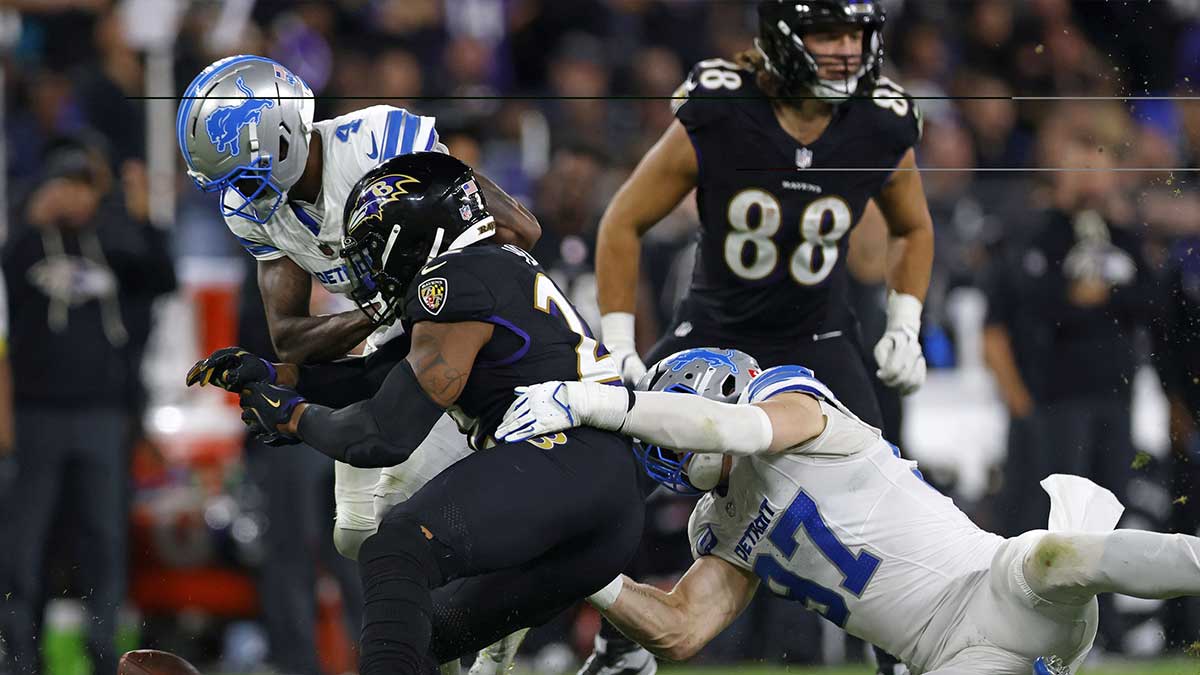Detroit Lions cornerback DJ. Reed (4) tackles Baltimore Ravens running back Derrick Henry (22) causing a fumble during the second half at M&T Bank Stadium.