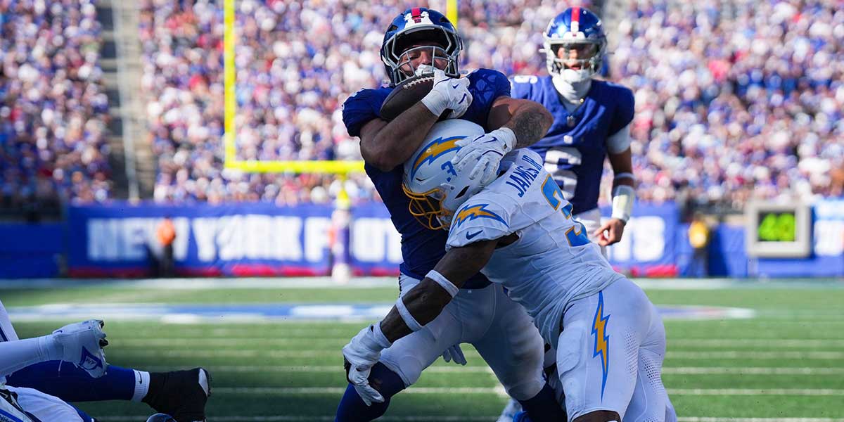 New York Giants running back Cam Skattebo (44) drives the ball as Los Angeles Chargers safety Derwin James Jr. (3) defends during a game at MetLife Stadium, Sep 28, 2025, East Rutherford, NJ, USA.