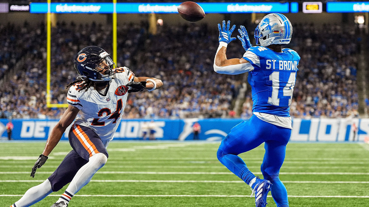 Detroit Lions wide receiver Amon-Ra St. Brown (14) makes a catch for a touchdown against Chicago Bears cornerback Nick McCloud (24) during the second half at Ford Field in Detroit on Sunday, Sept. 14, 2025.