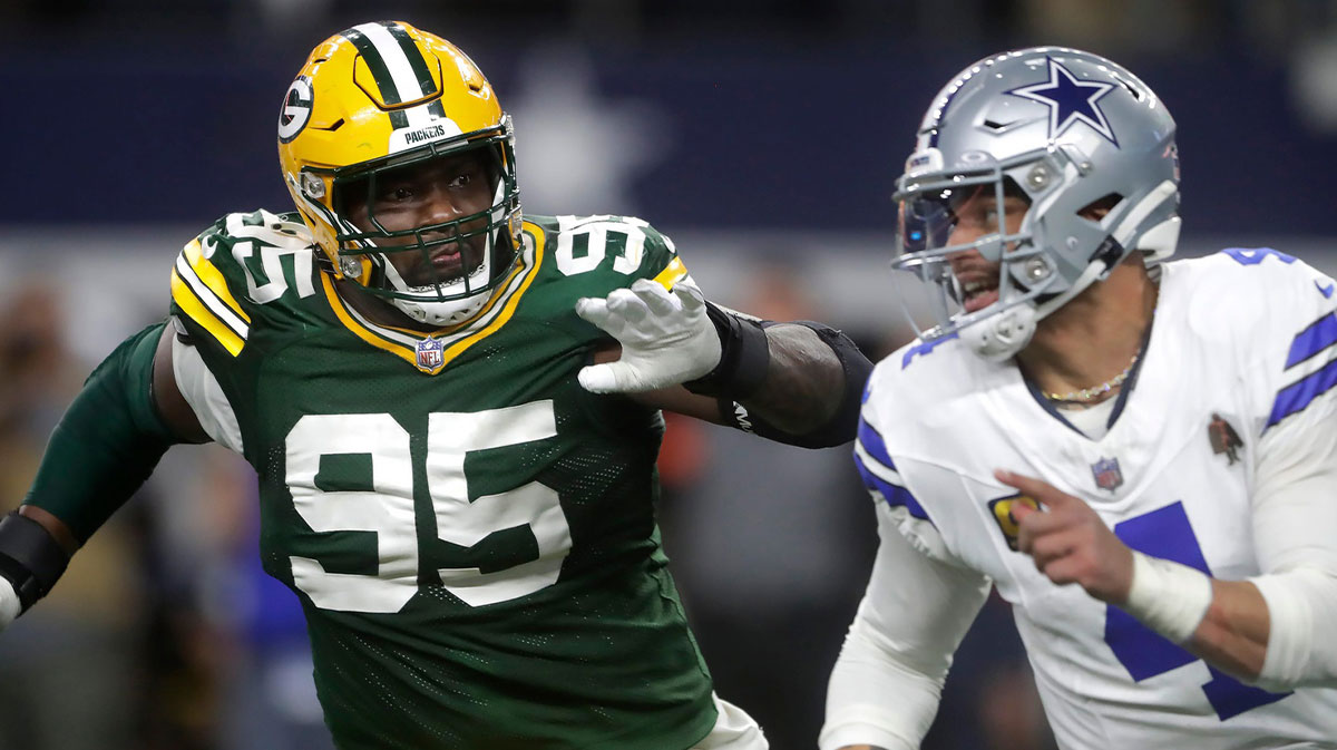 Green Bay Packers defensive tackle Devonte Wyatt (95) rushes Dallas Cowboys quarterback Dak Prescott (4) during the fourth quarter of their wild card playoff game Sunday, January 14, 2024 at AT&T Stadium in Arlington, Texas. Green Bay defeated Dallas 48-32.
