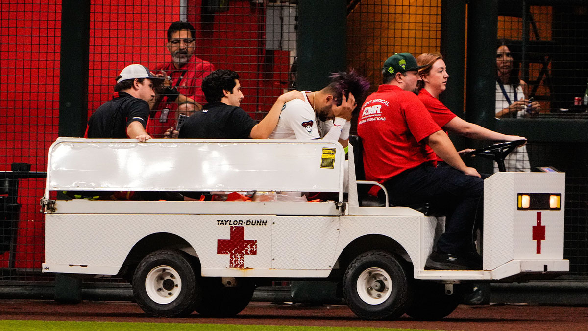 Diamondbacks outfielder Lourdes Gurriel Jr. (12) is taken off by cart