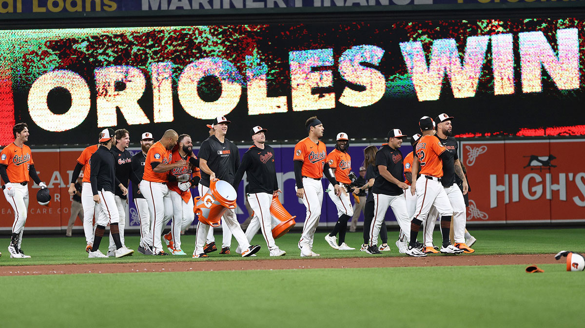 Baltimore Orioles players celebrate after a game against the Los Angeles Dodgers at Oriole Park at Camden Yards.