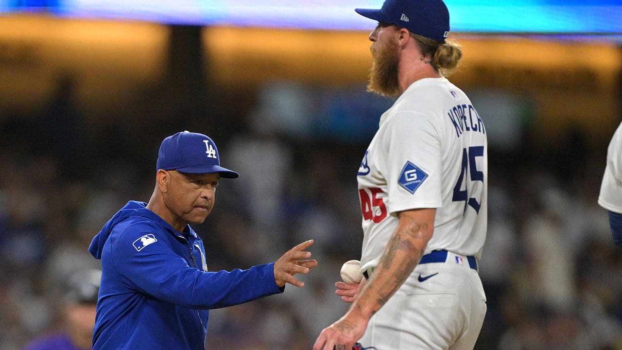Dodgers manager Dave Roberts (30) pulls relief pitcher Michael Kopech