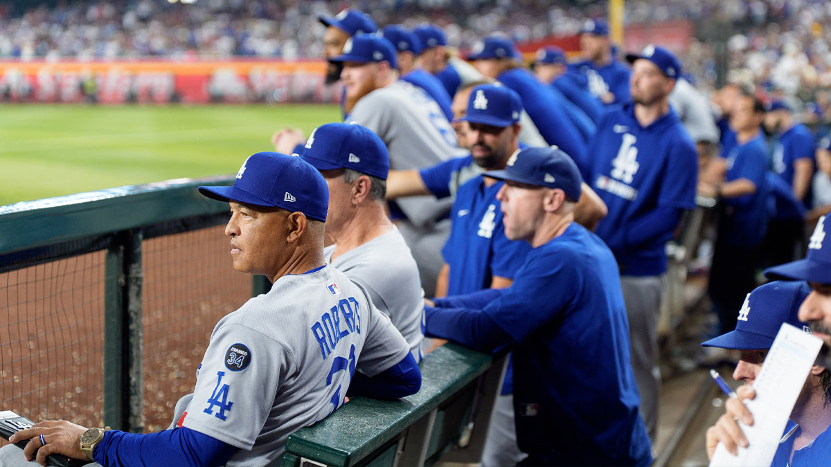 Los Angeles Dodgers manager Dave Roberts (30) watches on from the dugout during the eighth inning against the Arizona Diamondbacks at Chase Field.