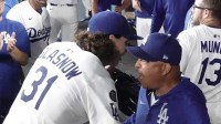 Dodgers manager Dave Roberts (30) speaks to starting pitcher Tyler Glasnow (31) after he was relieved after the seventh inning against the St. Louis Cardinals at Dodger Stadium