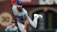 Los Angeles Dodgers pitcher Tanner Scott (66) throws a pitch against the San Francisco Giants during the tenth inning at Oracle Park.