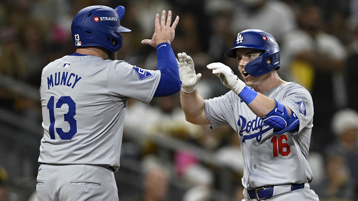 Dodgers catcher Will Smith (16) celebrates with third baseman Max Muncy (13) after hitting a two-run home run in the third inning against the San Diego Padres during game four of the NLDS for the 2024 MLB Playoffs at Petco Park