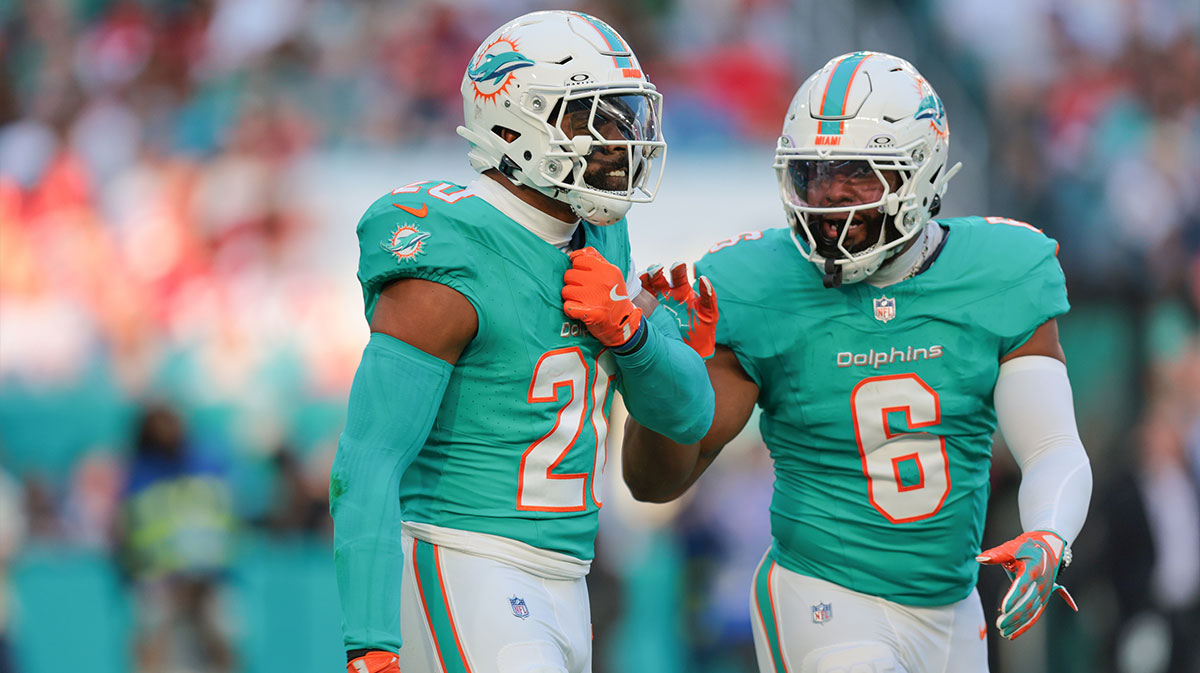 Dolphins linebacker Jordyn Brooks (20) celebrates with linebacker Anthony Walker Jr. (6) after sacking San Francisco 49ers quarterback Brock Purdy (not pictured) during the first quarter at Hard Rock Stadium