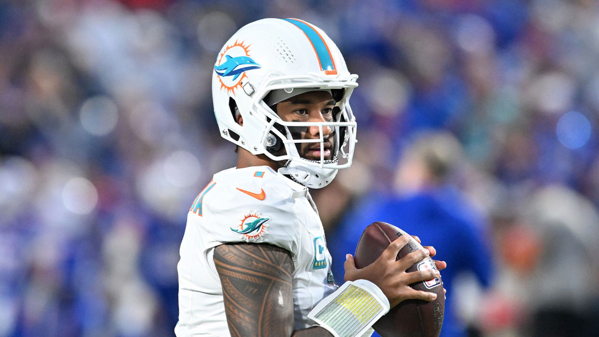 Dolphins quarterback Tua Tagovailoa (1) warms up before the game against the Buffalo Bills at Highmark Stadium
