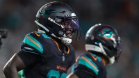 Miami Dolphins running back De'von Achane (28) reacts after scoring a touchdown against the New York Jets during the second half at Hard Rock Stadium.