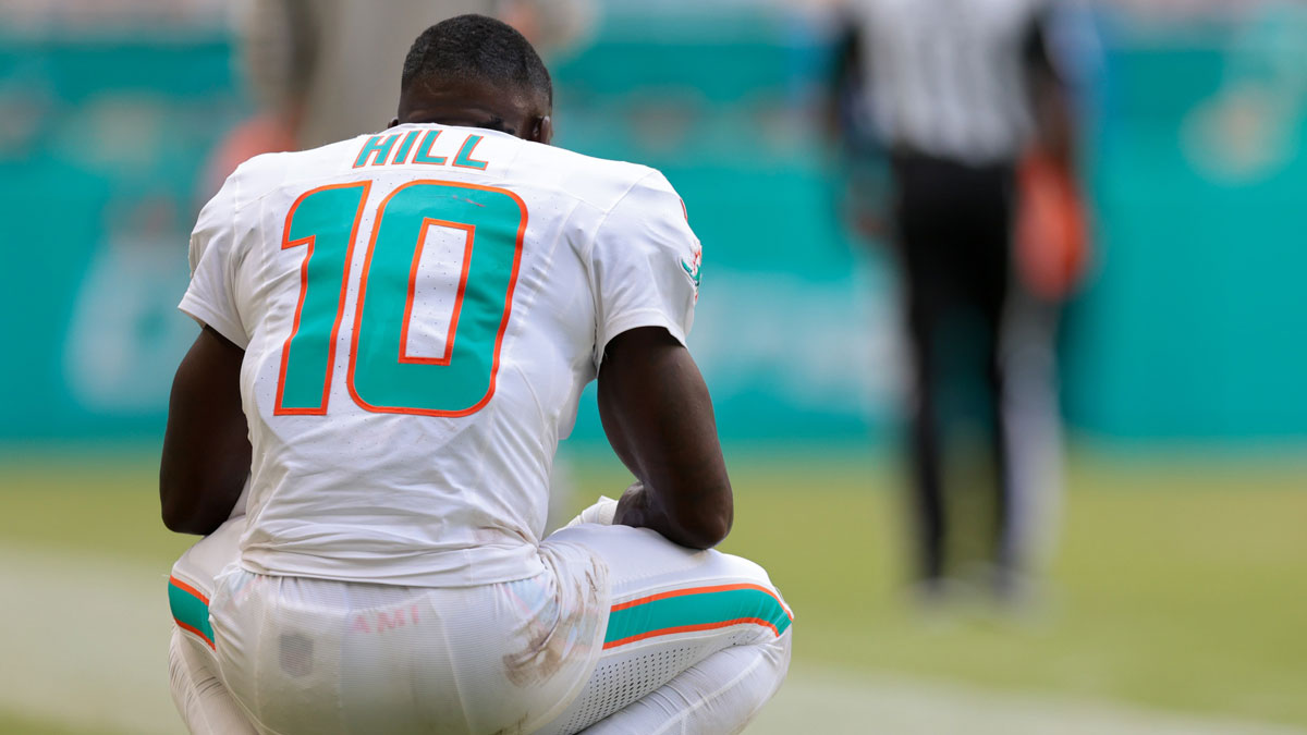 Dolphins wide receiver Tyreek Hill (10) watches from the sideline against the New England Patriots during the fourth quarter at Hard Rock Stadium