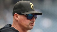 Pittsburgh Pirates manager Don Kelly (12) looks on from the dugout against the Milwaukee Brewers during the first inning at PNC Park.