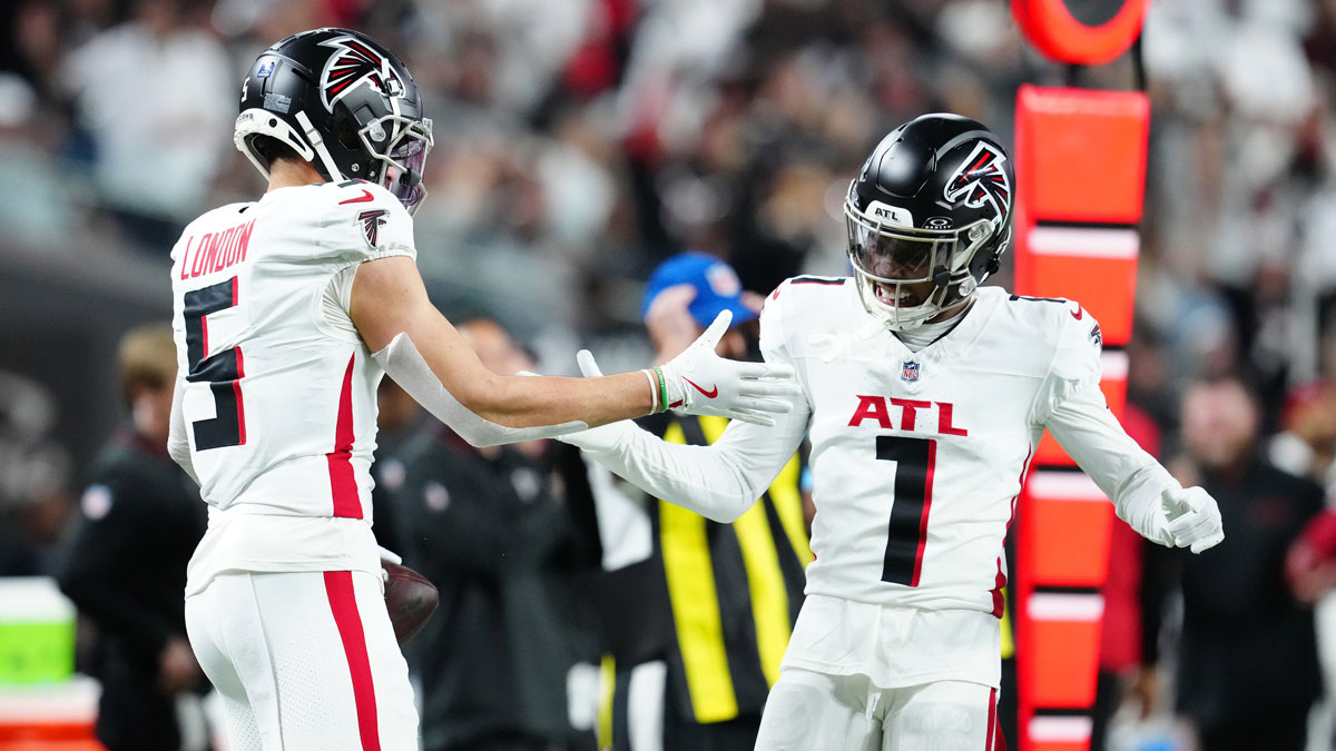 Atlanta Falcons wide receiver Drake London (5) celebrates with wide receiver Darnell Mooney (1) after scoring a touchdown against the Las Vegas Raiders during the first quarter at Allegiant Stadium.