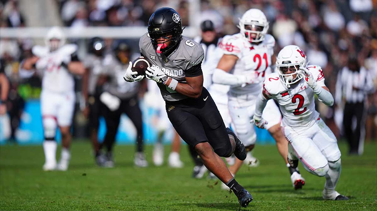 Colorado Buffaloes wide receiver Drelon Miller (6) carries for a touchdown in the second half against the Utah Utes at Folsom Field.