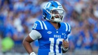 Duke Blue Devils quarterback Darian Mensah (10) comes running out onto the field before the start of the game against the Elon Phoenix at Wallace Wade Stadium.