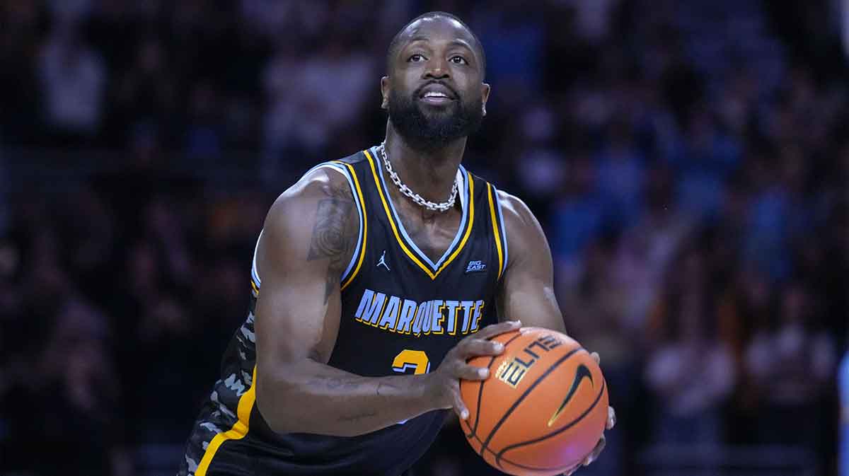Former Marquette Golden Eagles player Dwyane Wade shoots during a timeout during the first half of the game against the Providence Friars at Fiserv Forum.