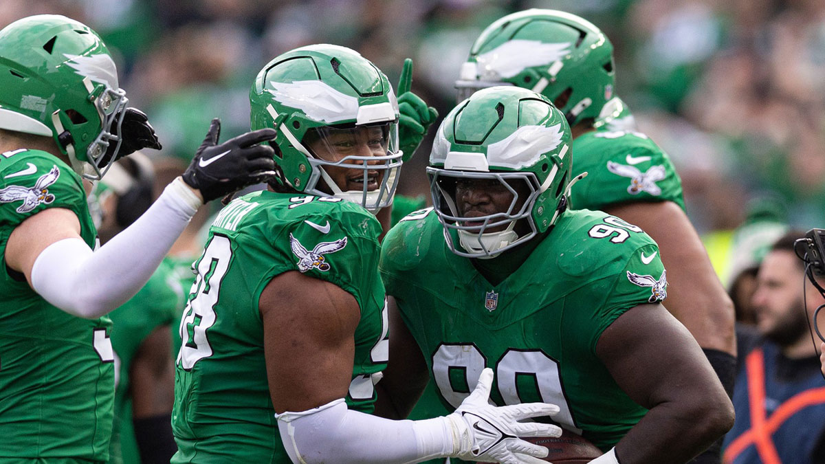 Eagles defensive tackle Jordan Davis (90) and defensive tackle Jalen Carter (98) celebrate a fumble recover against the Dallas Cowboys during the second quarter at Lincoln Financial Field